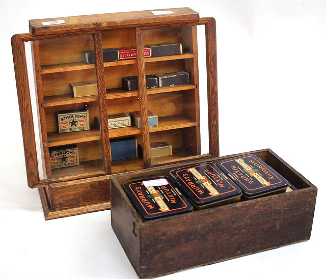 Appraisal: AN OLD OAK TOBACCONIST'S COUNTER TOP DISPLAY CABINET with sliding