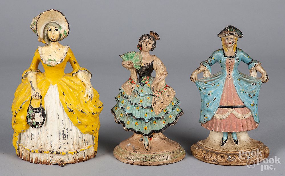 Appraisal: Three cast iron women doorstops Three cast iron women doorstops