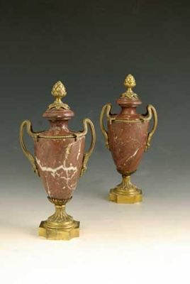 Appraisal: A pair of th century marble and ormolu mounted urns