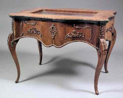 Appraisal: A French walnut and marquetry miniature display table of Louis