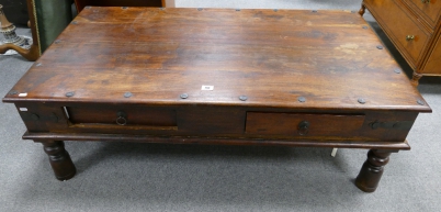 Appraisal: Indian mahogany metal studded coffee table with draws each side