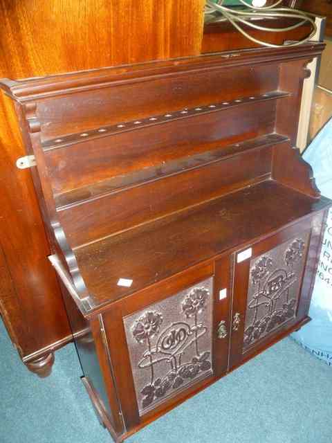 Appraisal: AN EDWARDIAN WALNUT HANGING CUPBOARD with open shelving and enclosed