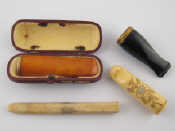 Appraisal: An amber cigar holder with yellow metal tests carat gold