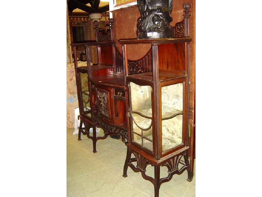 Appraisal: An Edwardian mahogany display cabinet enclosed and fitted with an