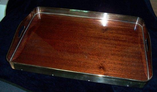 Appraisal: A rectangular tray the mahogany base to a plated gallery