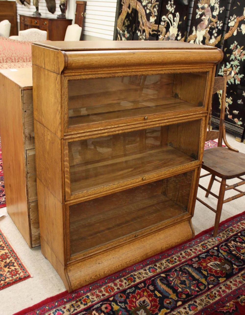 Appraisal: THREE-SECTION STACKING OAK BOOKCASE American c each horizontal section having