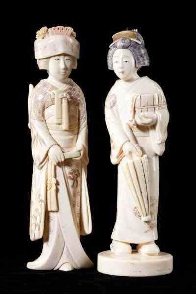 Appraisal: Two Japanese Geisha Ivory Okimonosearly th century both signed on