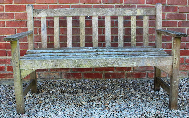 Appraisal: A SMALL TEAK GARDEN BENCH with slatted back and seat