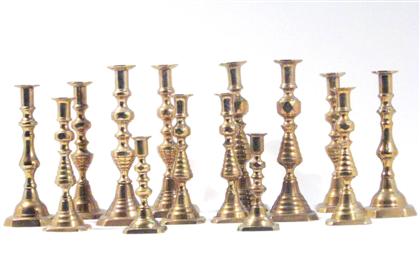 Appraisal: Group of brass push-up candlesticks th century All of molded