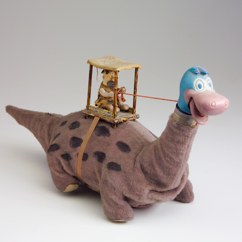 Appraisal: Fred Flinstone Dino toy in fair condition x x