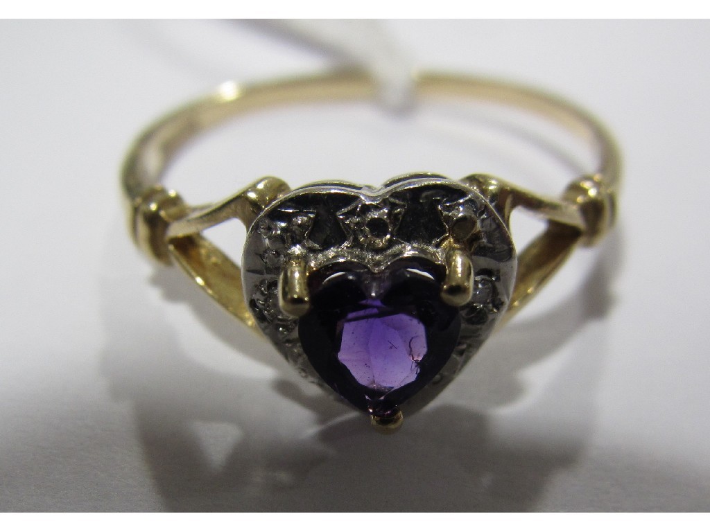 Appraisal: Nine carat gold amethyst and diamond heart shaped cluster ring