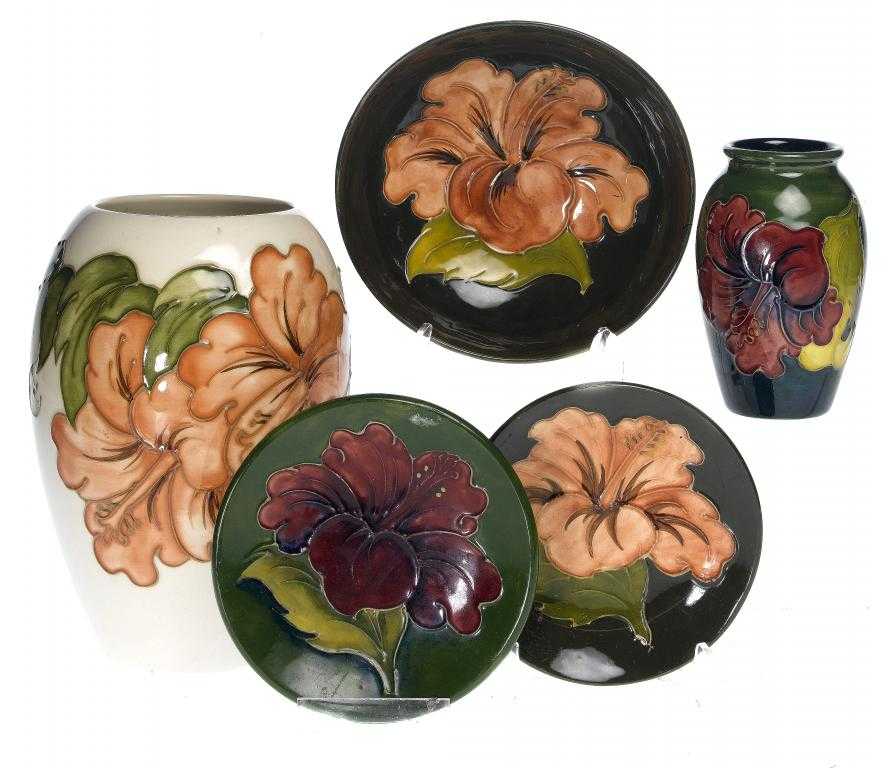 Appraisal: TWO MOORCROFT HIBISCUS VASES A BOWL AND TWO DISHES DESIGNED