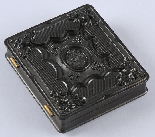 Appraisal: Sixth plate union case Geometric Scroll Krainik- Case contains ambrotype