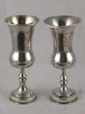 Appraisal: A matched pair of large silver kiddush cups one Chester