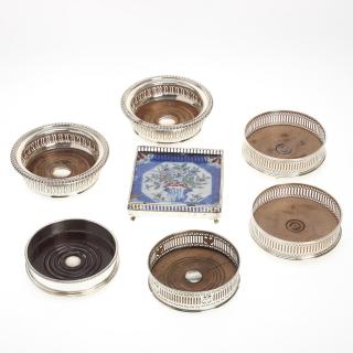 Appraisal: English sterling wine coasters and trivets English sterling wine coasters