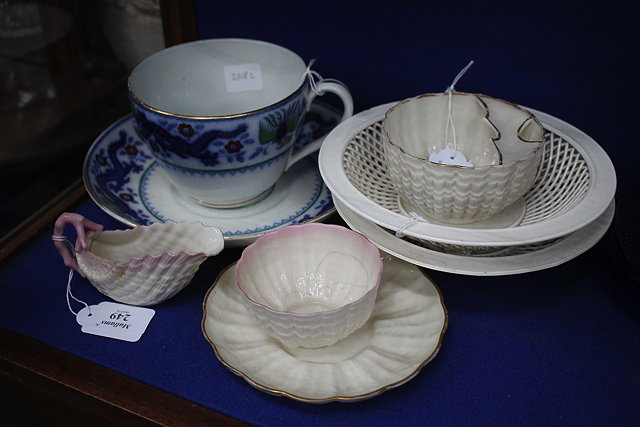 Appraisal: A BELEEK PORCELAIN MOUSTACHE CUP AND SAUCER a similar cream