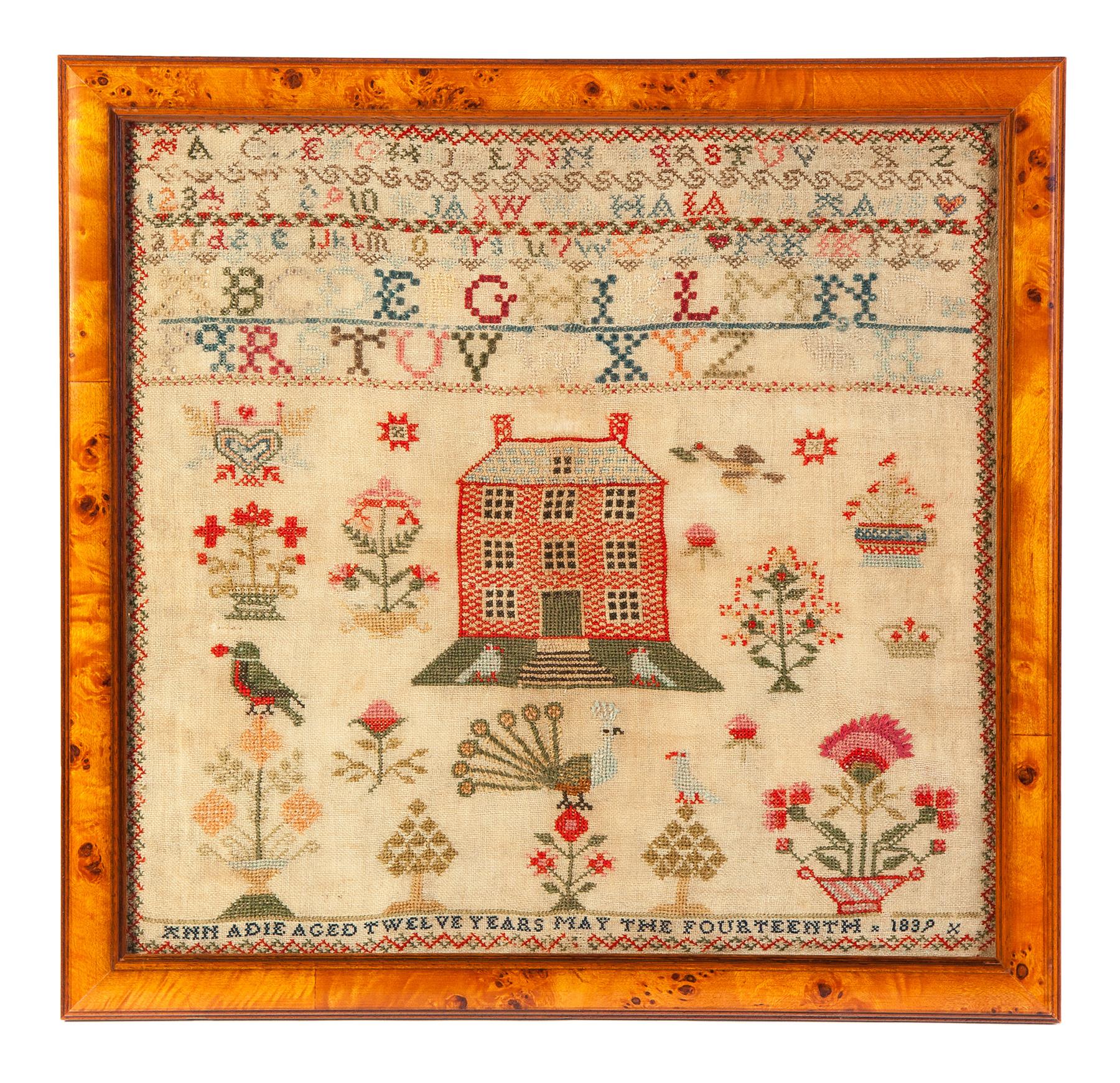 Appraisal: FRAMED SAMPLER BY ANN ADIE England natural linen colored threads