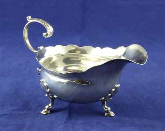 Appraisal: A George II silver sauceboat with engraved armorial on shell