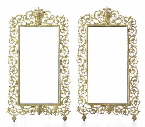 Appraisal: Pair Victorian Rococo style gilt-bronze mirrors with mask pediment on