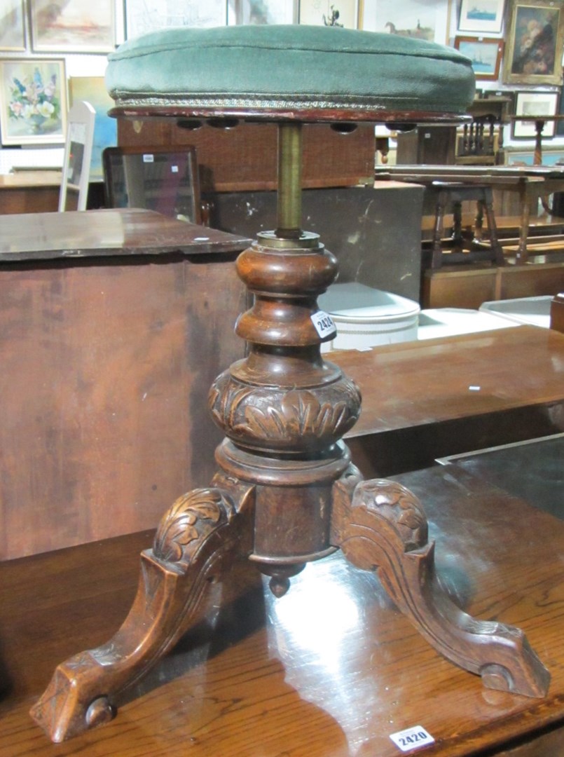 Appraisal: A Victorian tripod adjustable piano stool