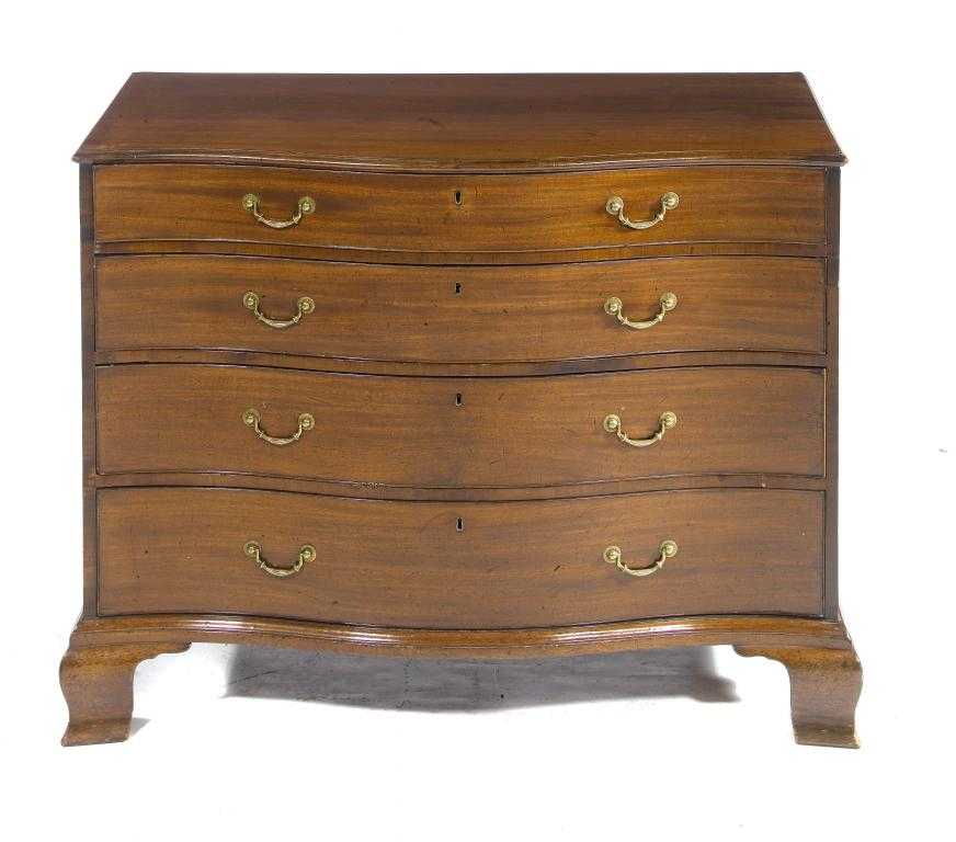 Appraisal: A GEORGE III MAHOGANY SERPENTINE CHEST OF DRAWERS fitted four