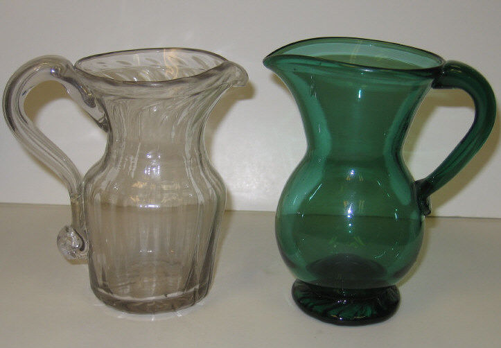 Appraisal: AMERICAN FREEBLOWN GLASS CREAMERS Green inch bulbous form creamer with