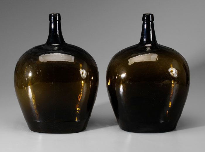 Appraisal: Pair Mold-Blown Bottles th century medium olive glass with collared