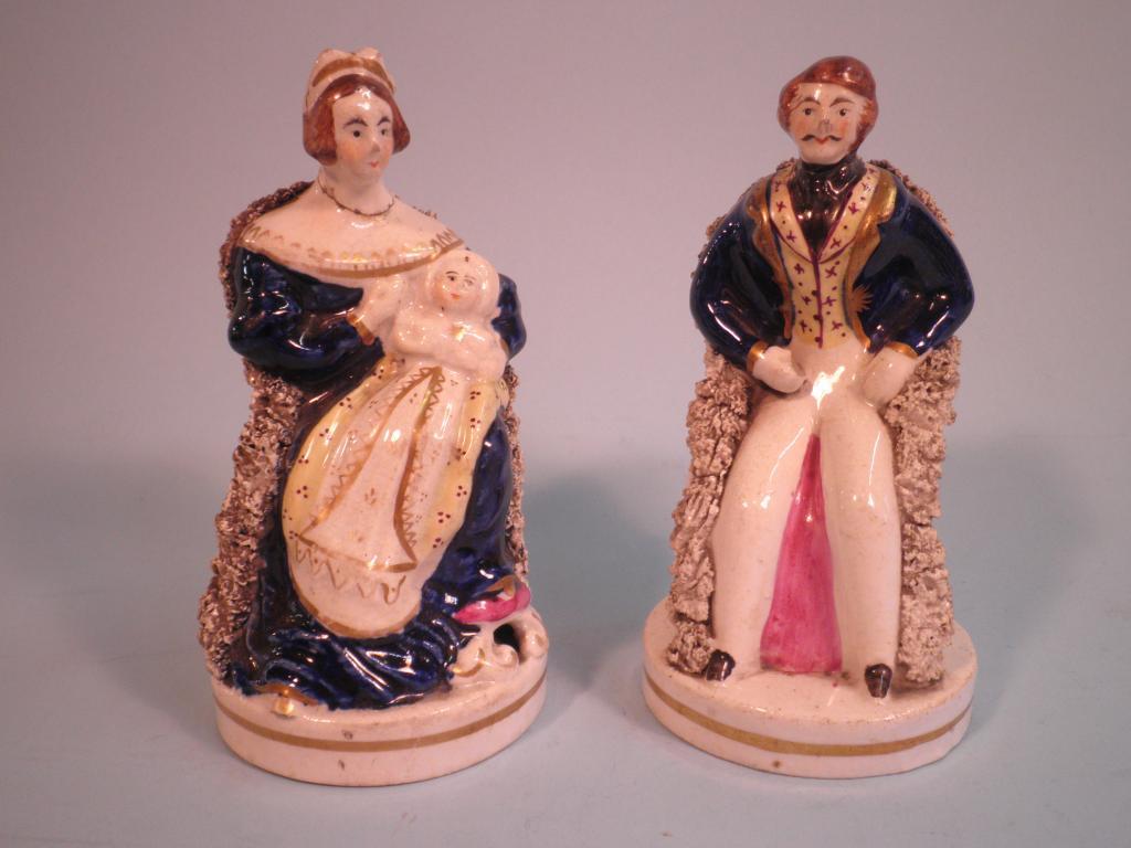 Appraisal: A pair of Victorian Staffordshire pottery figures each in the