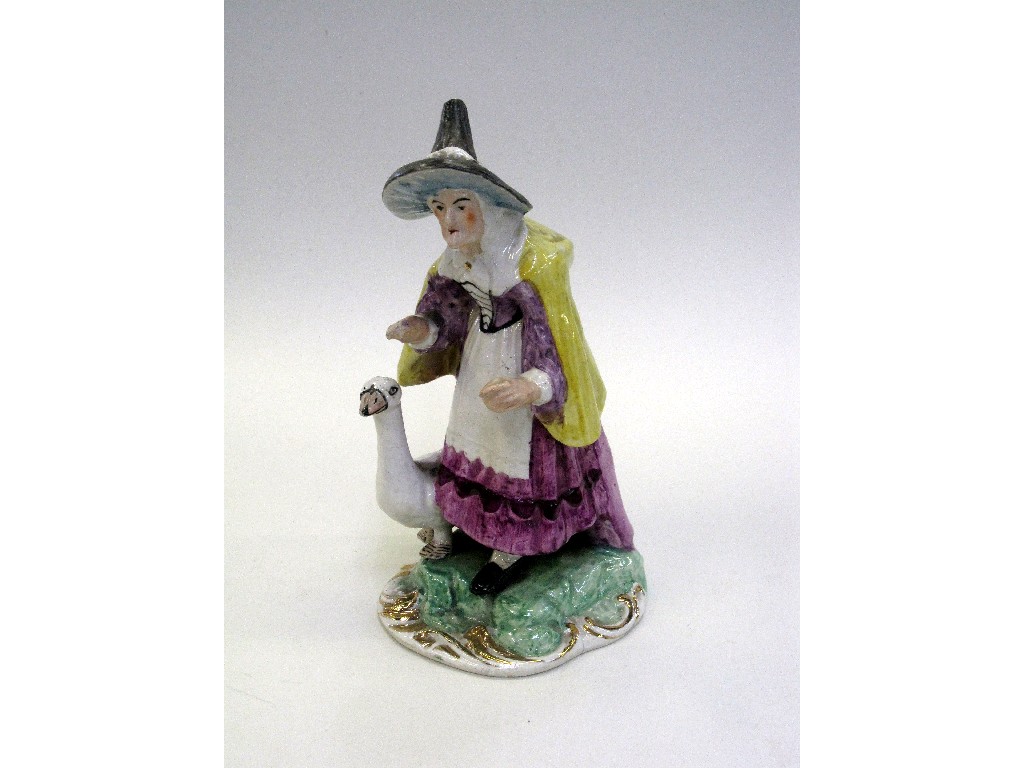 Appraisal: Staffordshire figure group of a witch with a goose