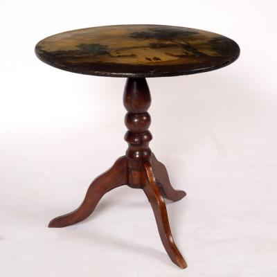 Appraisal: A circular table the top painted a scene of figures