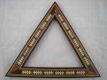 Appraisal: A triangular cribbage board with peg compartment cm side