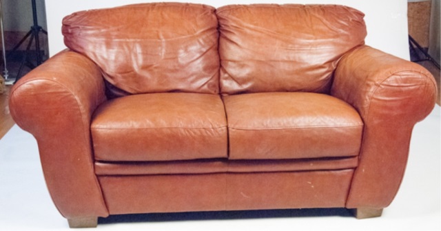 Appraisal: Brown Leather Loveseat H x W Wear commensurate with age