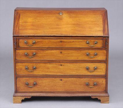 Appraisal: GEORGE III MAHOGANY SLANT-FRONT DESK The flap opening to drawers