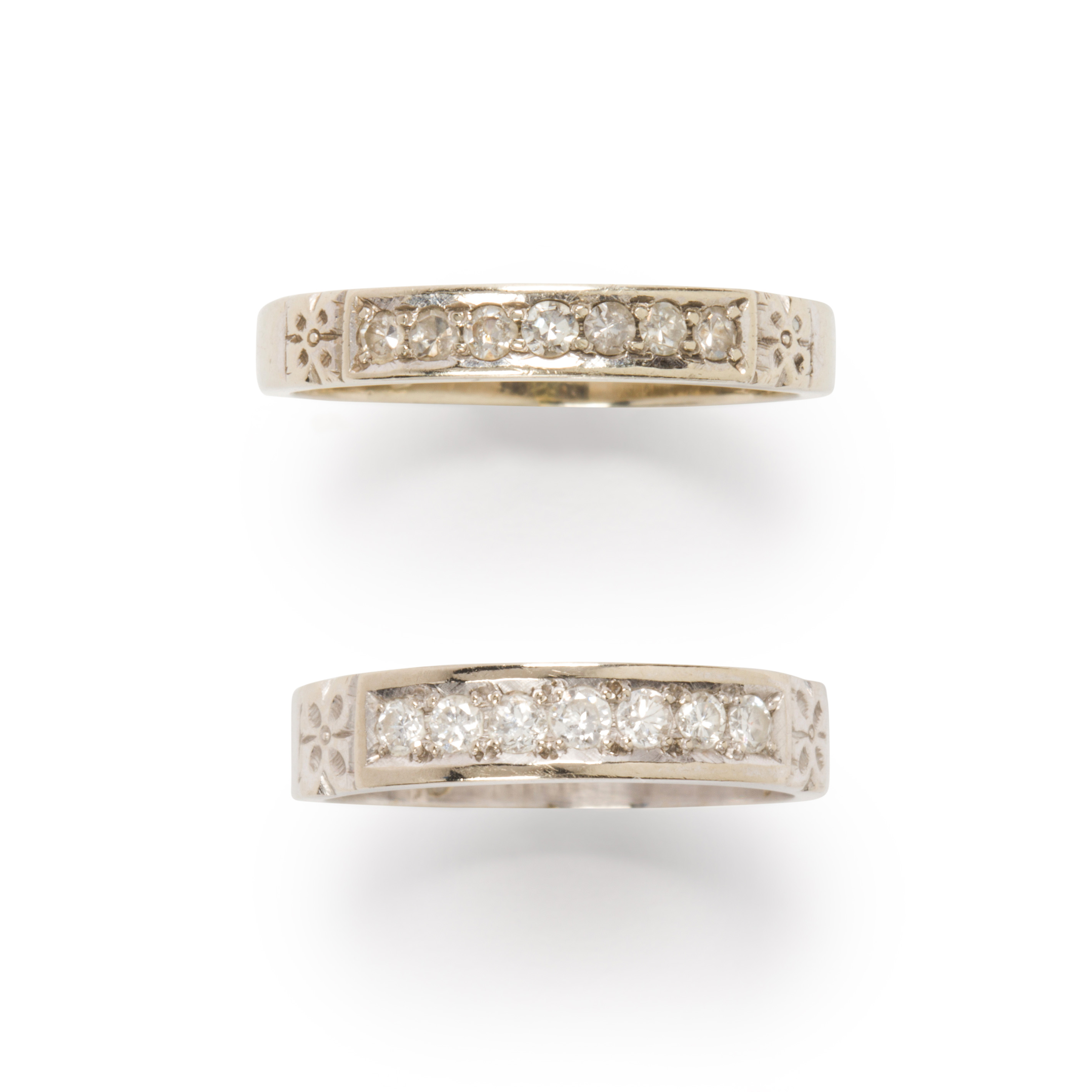 Appraisal: A PAIR OF DIAMOND AND FOURTEEN KARAT WHITE GOLD RINGS