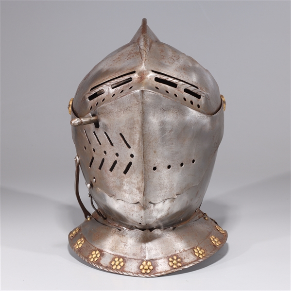 Appraisal: An elaborately pierced close helm in the style of th