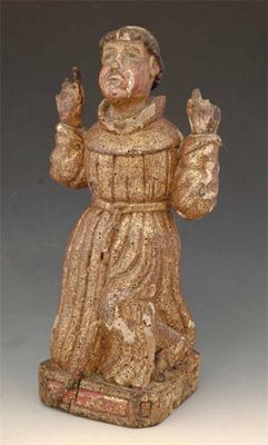 Appraisal: A carved giltwood figure of St Francis kneeling receiving the