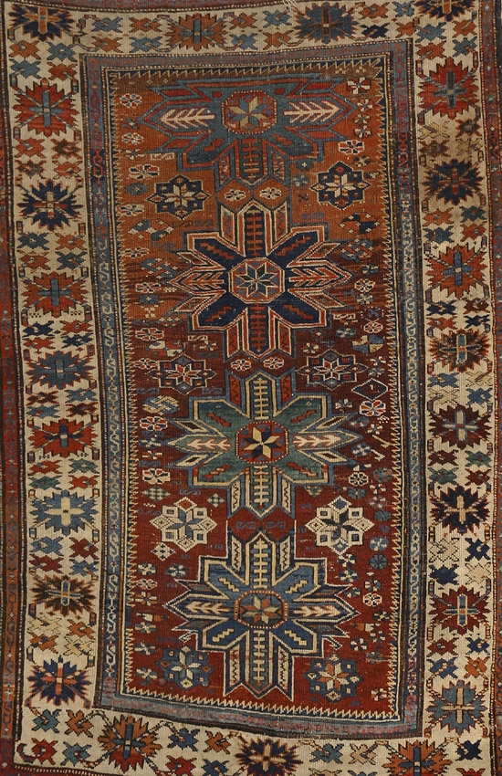 Appraisal: Kazak Rug Second Quarter th Century Shaded red ground with