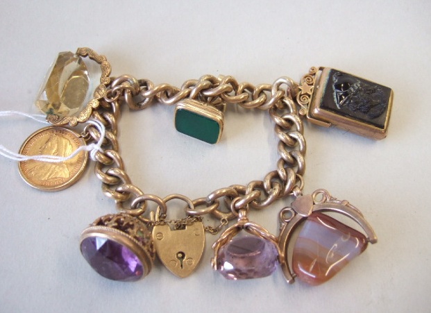 Appraisal: A ct gold curb link charm bracelet with a ct