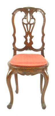 Appraisal: A continental walnut side chair the carved moulded and pierced