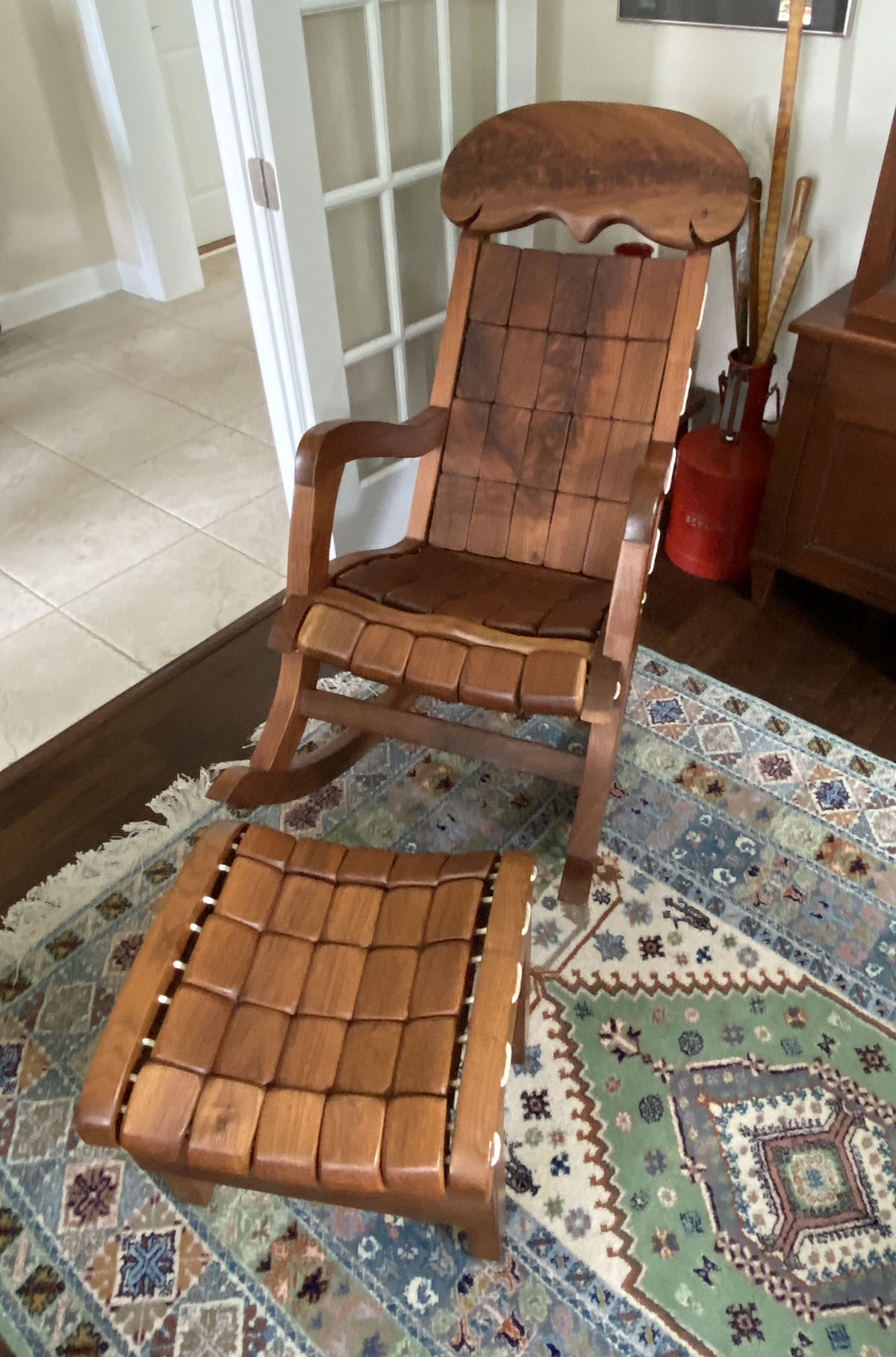 Appraisal: PC GERRY GRANT BLACK WALNUT ROCKER AND STOOL Unique design