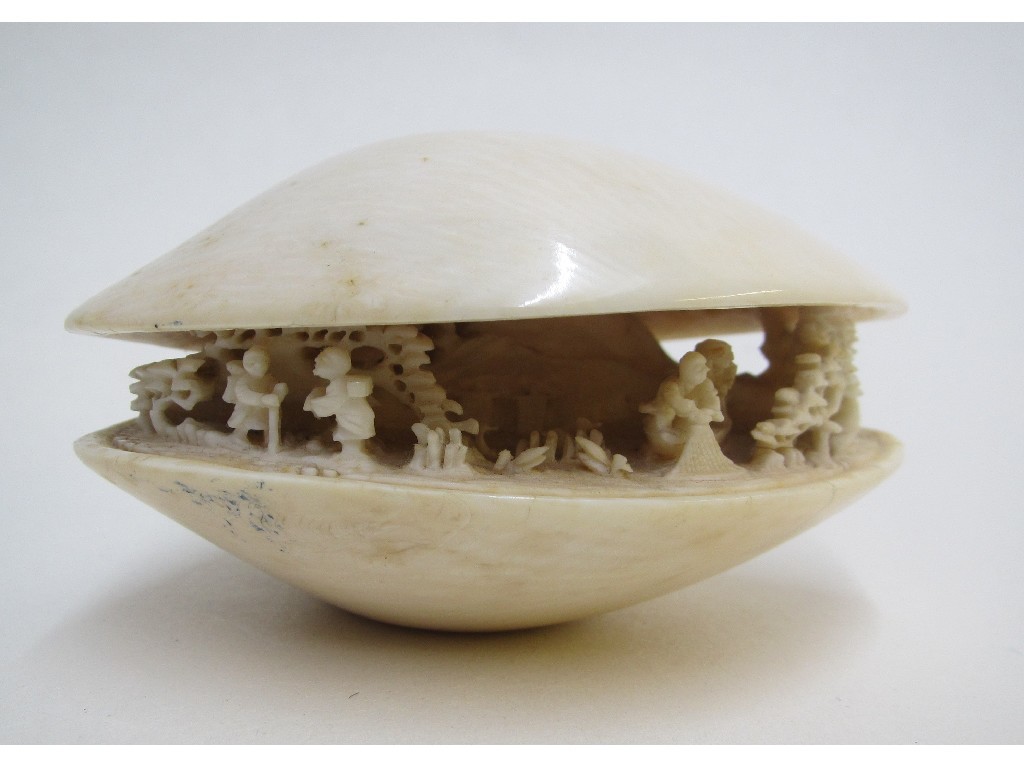 Appraisal: A Japanese carved ivory model of a clam shell enclosing