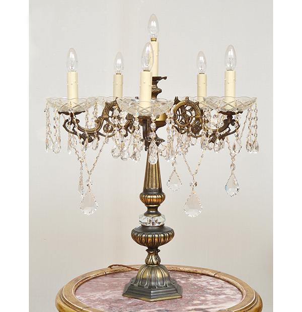 Appraisal: AN ELECTRIFIED CRYSTAL AND BRASS FIVE BRANCH CHANDELIER CM HIGH