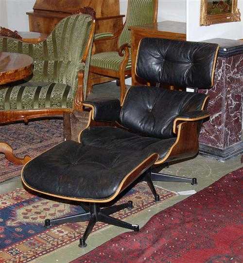 Appraisal: LOUNGE-CHAIR MIT OTTOMAN Kopie nach Ray und Charles Eames um