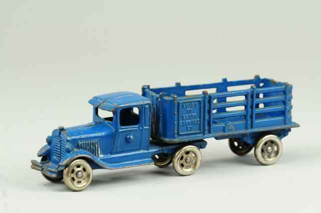 Appraisal: A C WILLIAMS TRACTOR TRAILER Cast iron painted blue Model