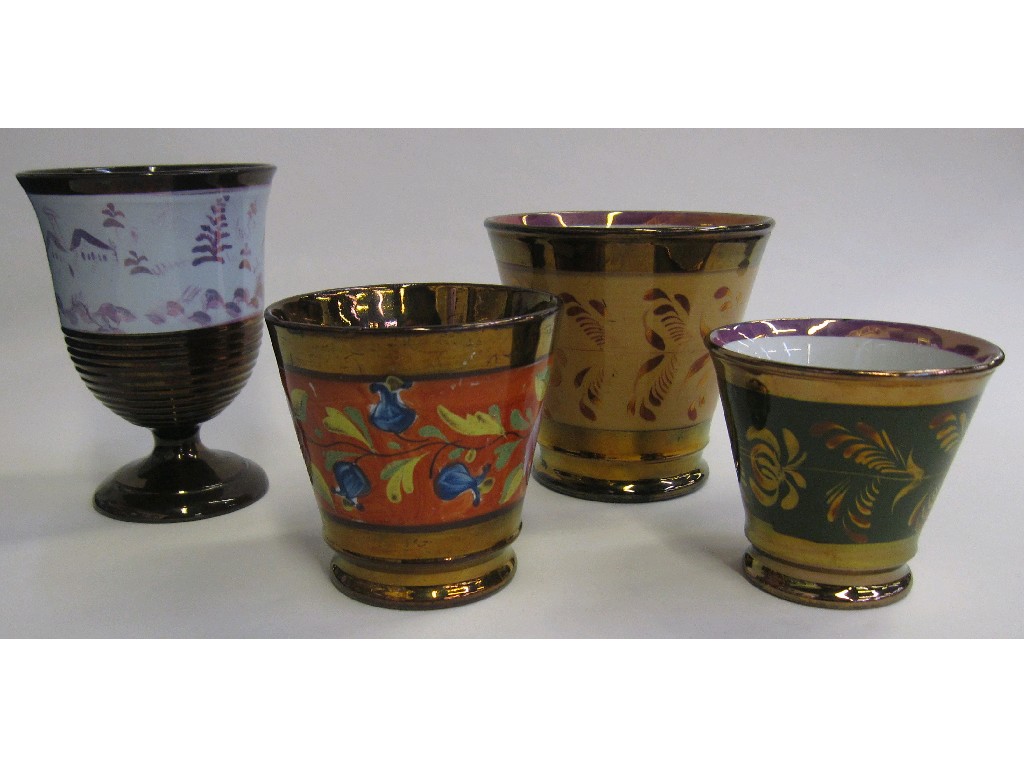 Appraisal: Three copper lustre tumblers and a goblet