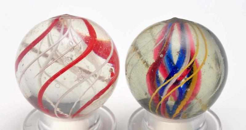 Appraisal: Lot of Swirl Marbles Description The smaller marble is a