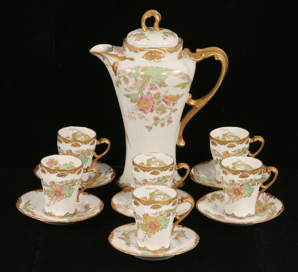 Appraisal: Limoges gilt floral chocolate set transfer and painted decoration Chocolate