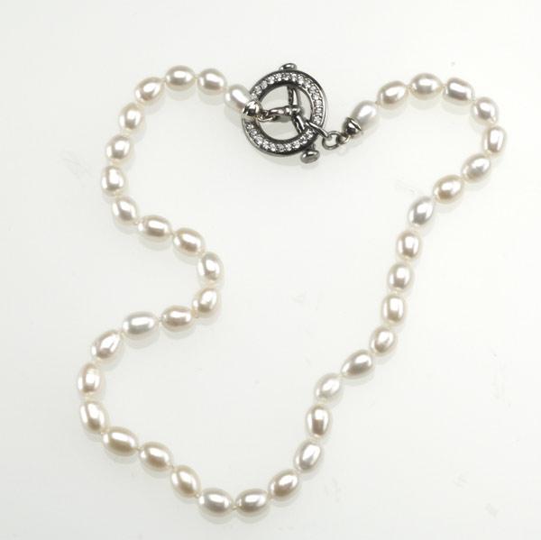 Appraisal: LINKS OF LONDON Cultured pearl white sapphire silver mounted toggle