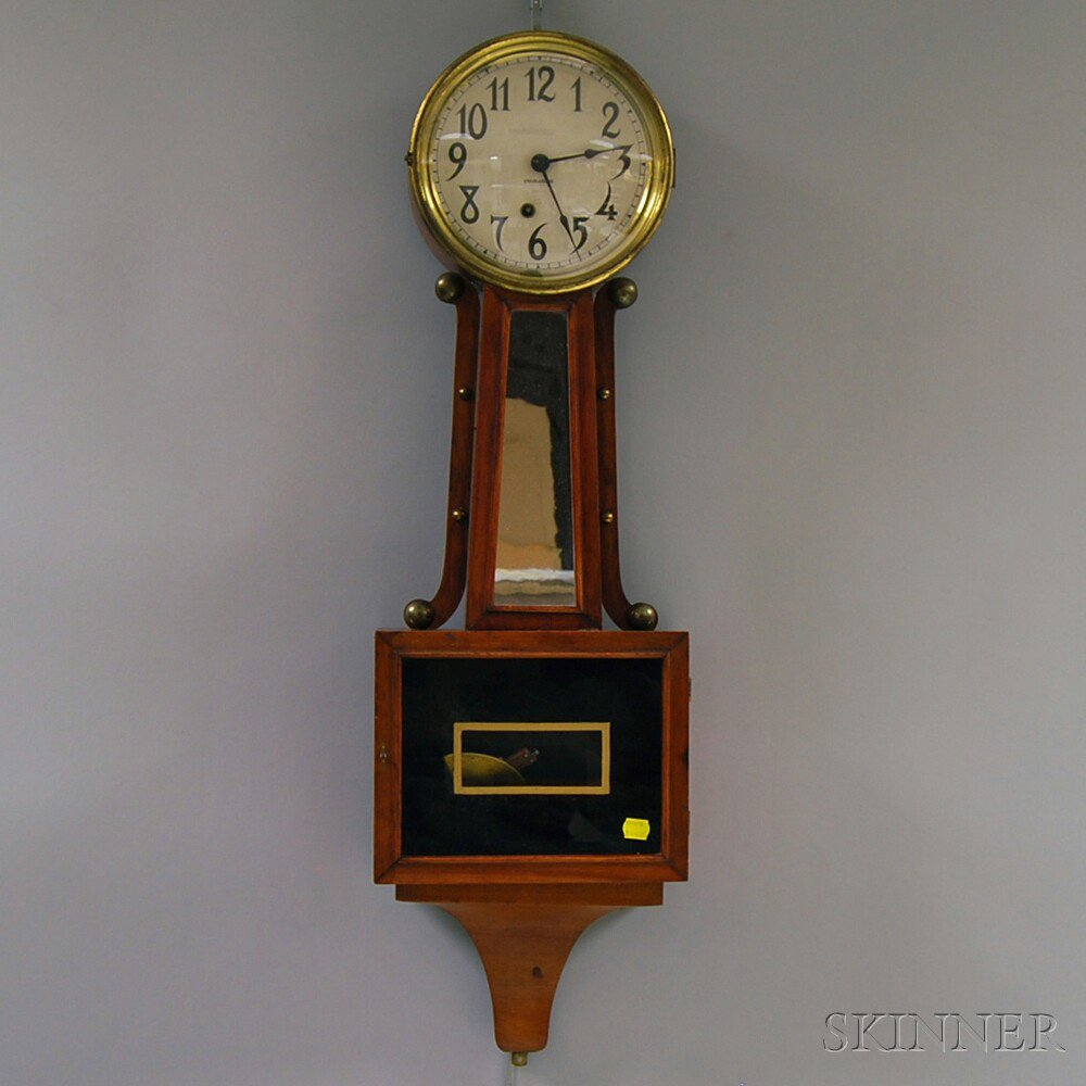 Appraisal: Ingraham Maple Banjo Clock -in paper Arabic numeral dial mirrored