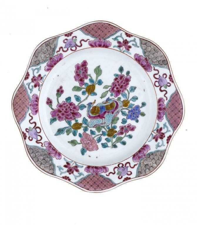 Appraisal: A DERBY PLATE attractively painted in bright famille rose enamels